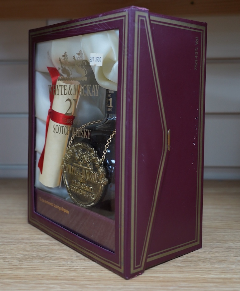 A cased bottle of Whyte & MacKay 21 year old Scotch whisky. Condition - good